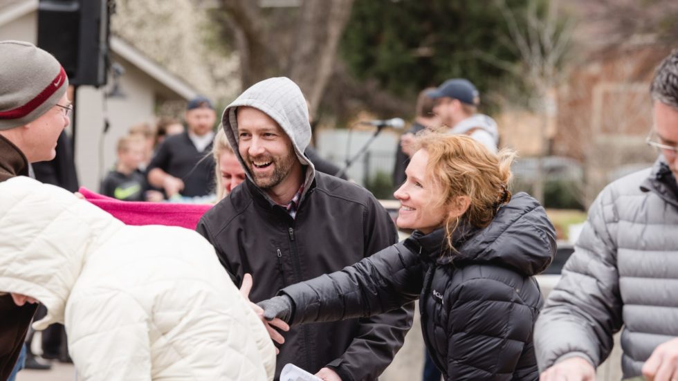 Man and woman greeting neighbors