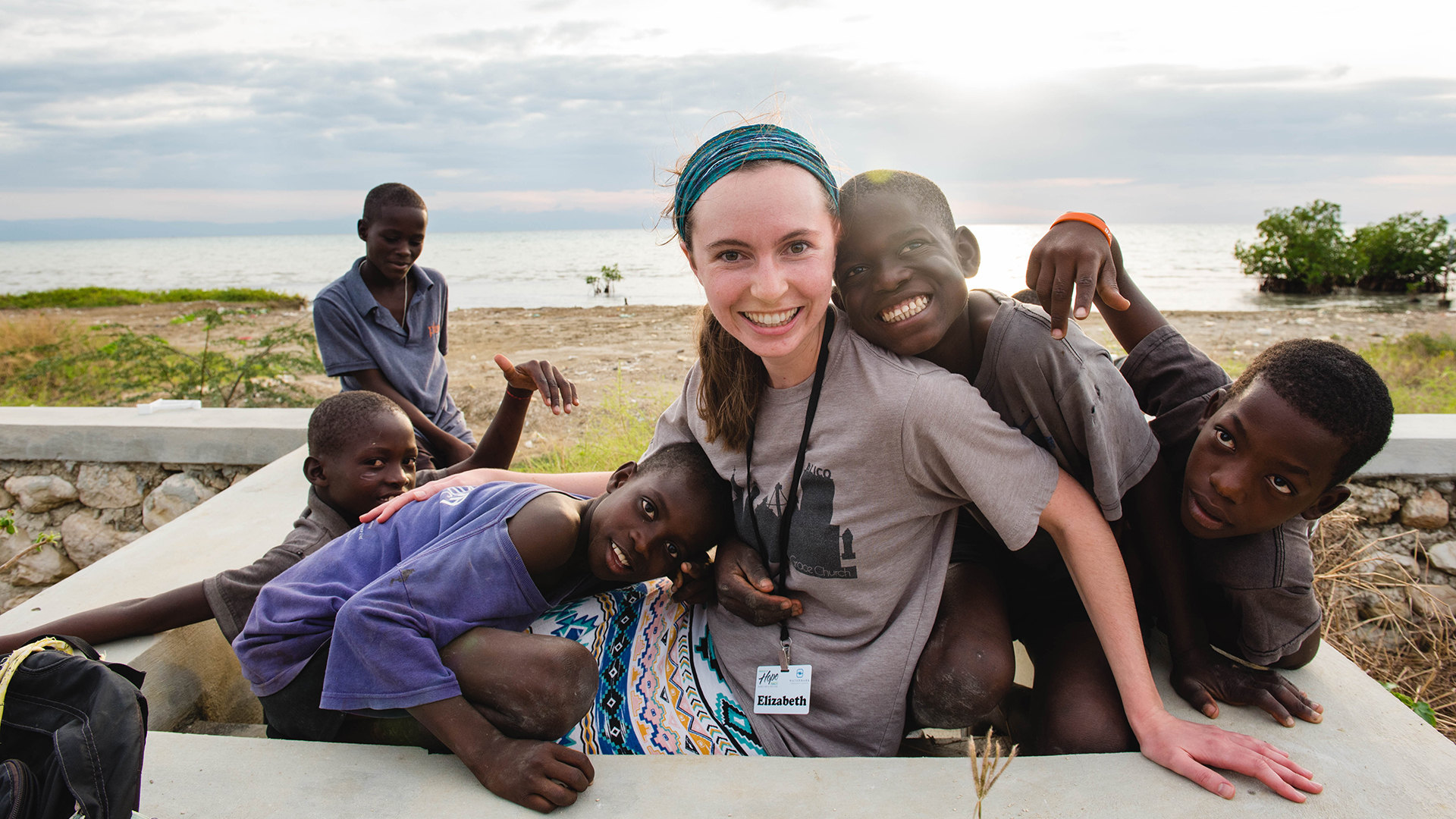 Woman embraced by children