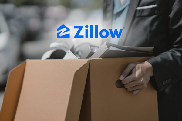 Zillow logo with an employee carrying a box of desk items after layoffs