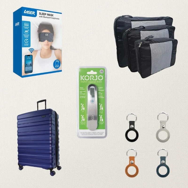 Travel accessories including a Laser sleep mask, packing cubes, Korjo luggage scale, navy suitcase, and four colorful AirTag keyrings.