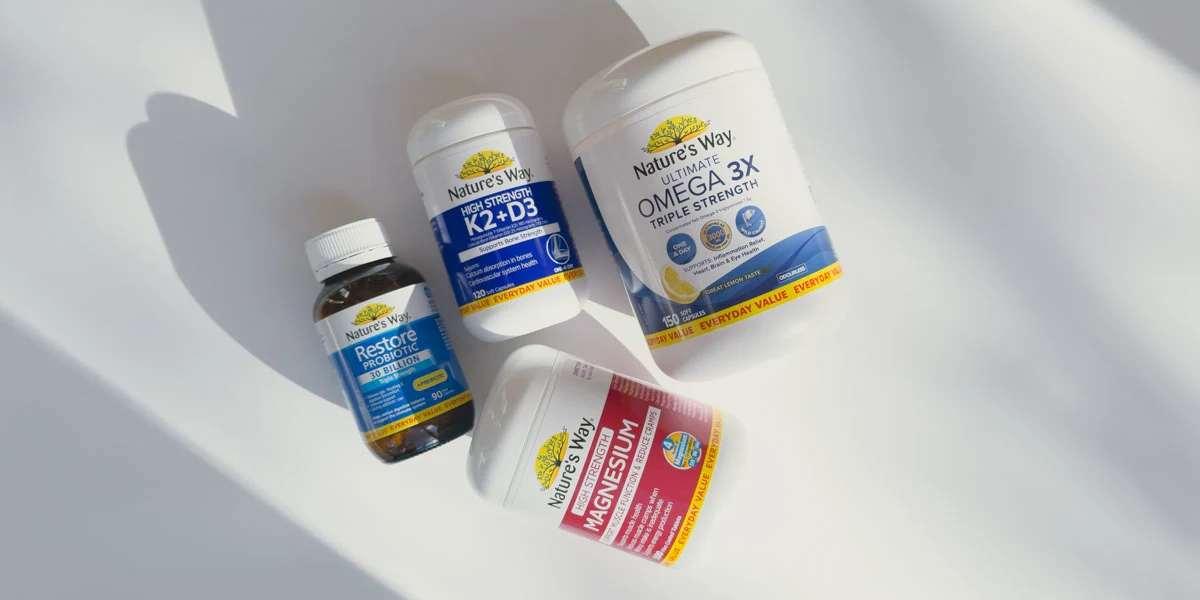 Nature's Way vitamin products on a white bench