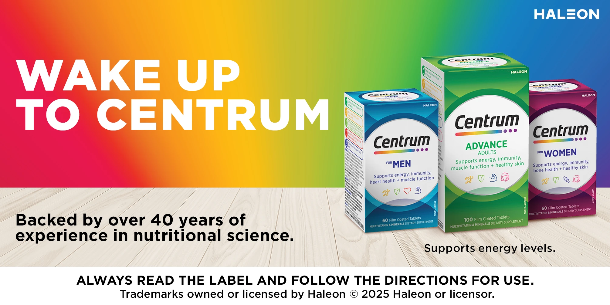 Centrum multivitamin boxes for Men and Women 50+ shown with Canstar Blue award badge against colorful rainbow gradient background