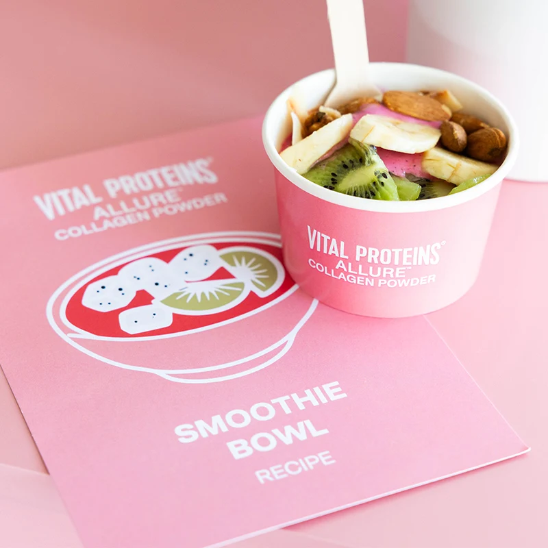 Pink Vital Proteins smoothie bowl with fresh fruit and nuts, shown next to recipe card featuring fruit illustration.