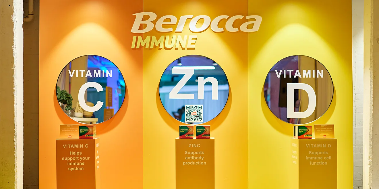 Berocca Immune display showing three circular windows highlighting Vitamin C, Zinc, and Vitamin D with their immune support benefits.