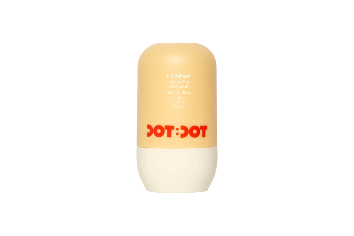 Dot Dot Hit Refresh Lemon Pop Deodorant in a yellow and cream roll-on container with red logo, 1.69 fl oz.
