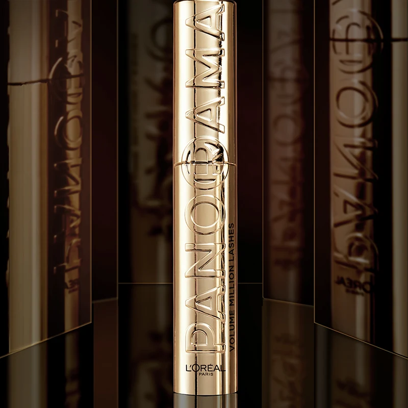 Gold metallic L'Oreal Panorama mascara tube with reflective surfaces and embossed lettering against dark background.