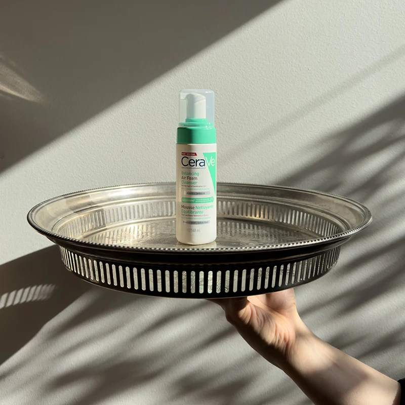 CeraVe Balancing Air Foam Cleanser in-front of leaves