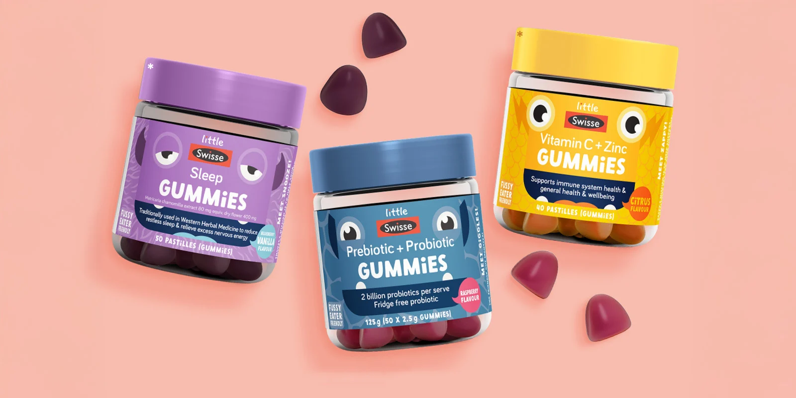 Four Little Swisse vitamin gummy jars lined up, including Prebiotic, Sleep, Vitamin C, and Iron supplements with colorful lids.