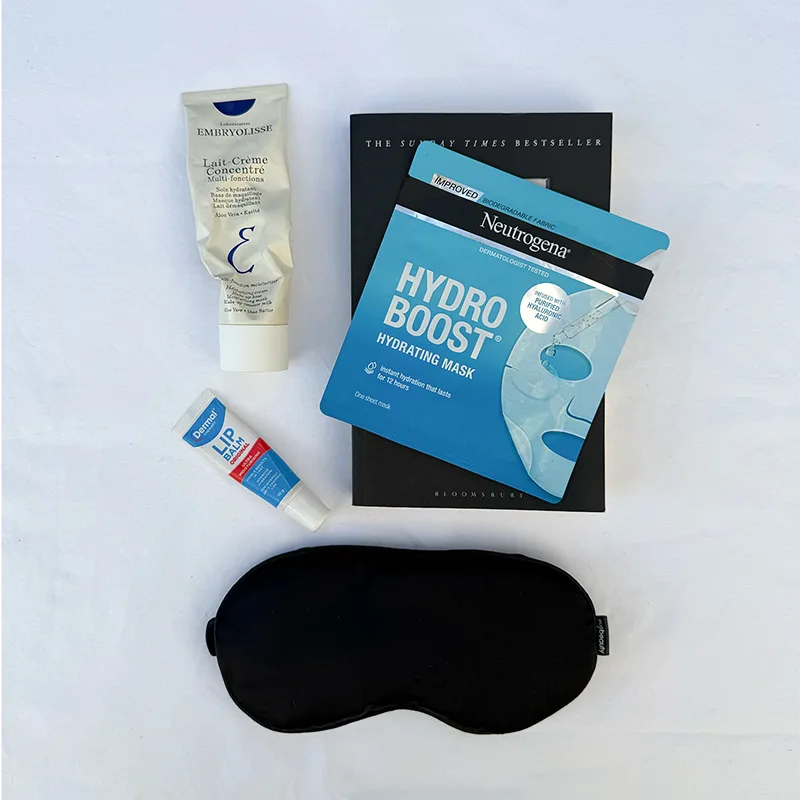 Collection of skincare items including Neutrogena Hydro Boost mask, Olay products, sleep mask, and facial treatments on white background.