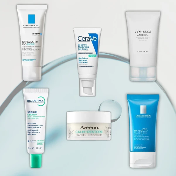 Six skincare products arranged on a light blue background, including La Roche-Posay, CeraVe, Skin1004, Bioderma, Aveeno, and La Roche-Posay moisturizers.