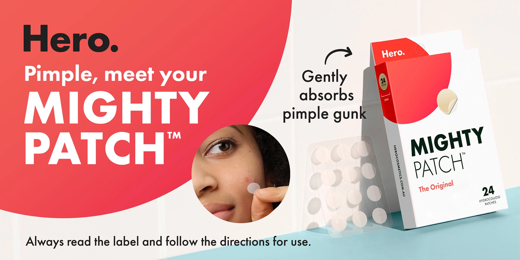 Product packaging for Hero Mighty Patch acne patches showing white circular patches and product box against coral background