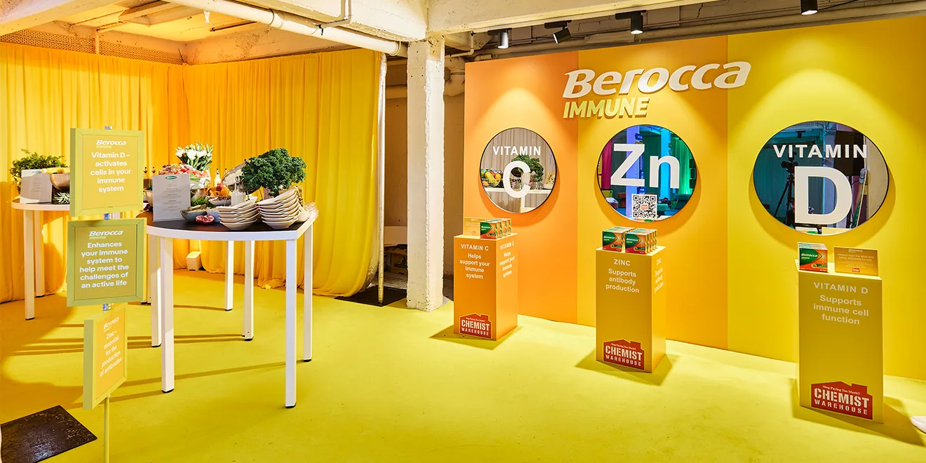 Berocca Immune product display with yellow backdrop featuring circular panels highlighting Vitamin C, Zinc, and Vitamin D benefits.