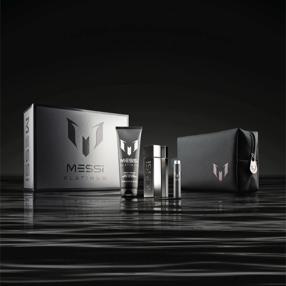 Messi Platinum fragrance gift box collection displayed on reflective black surface with silver packaging
