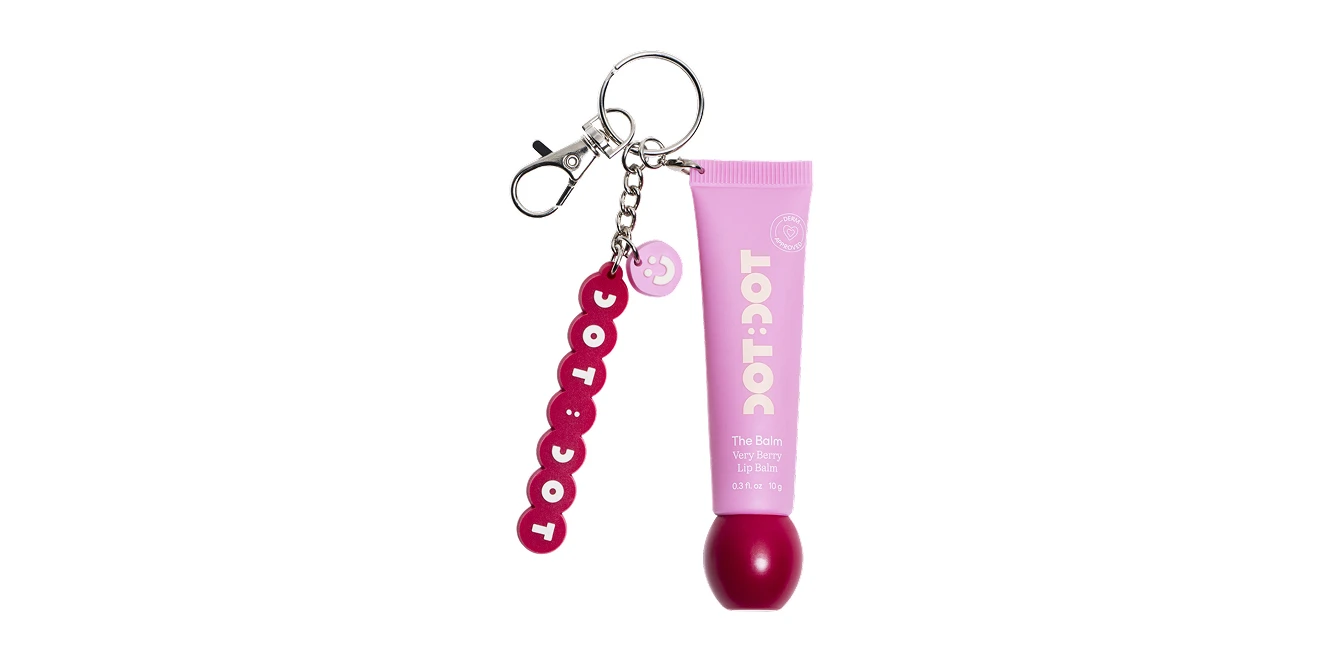 DOT:DOT The Balm Very Berry Lip Balm in a pink tube with a berry applicator, attached to a keychain with a red logo charm.