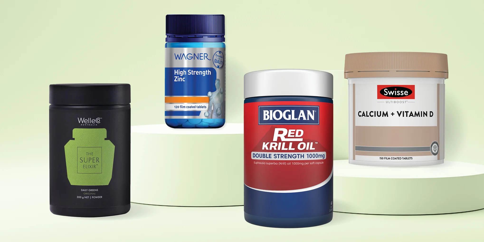 Four dietary supplement containers: WelleCo Super Elixir, Wagner Zinc, Bioglan Red Krill Oil, and Swisse Calcium + Vitamin D