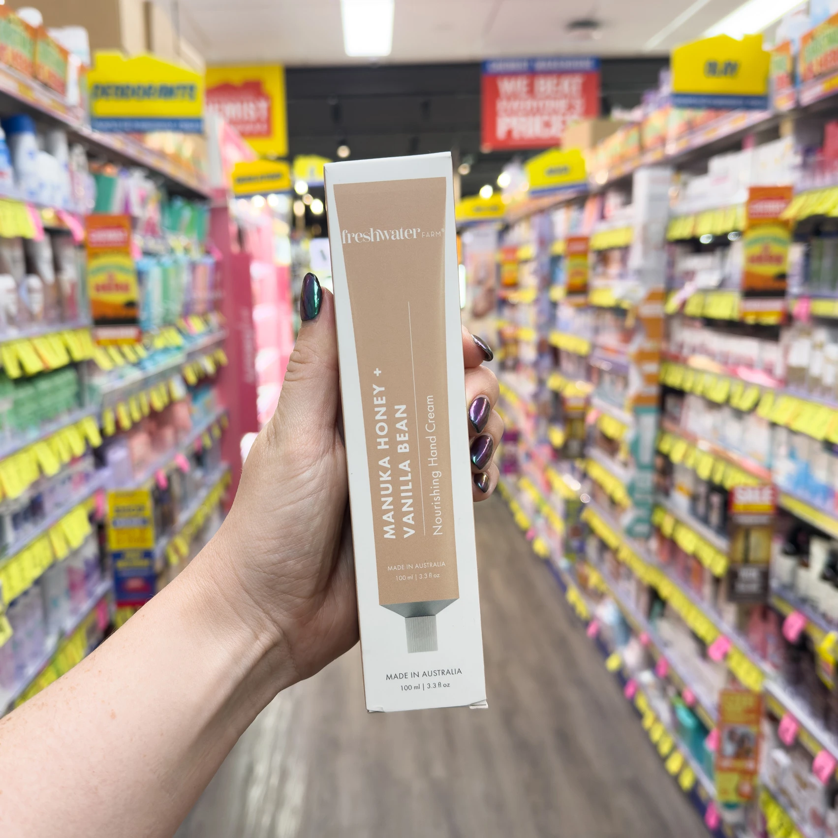 Freshwater beauty product against blurred retail store shelves with colorful product displays