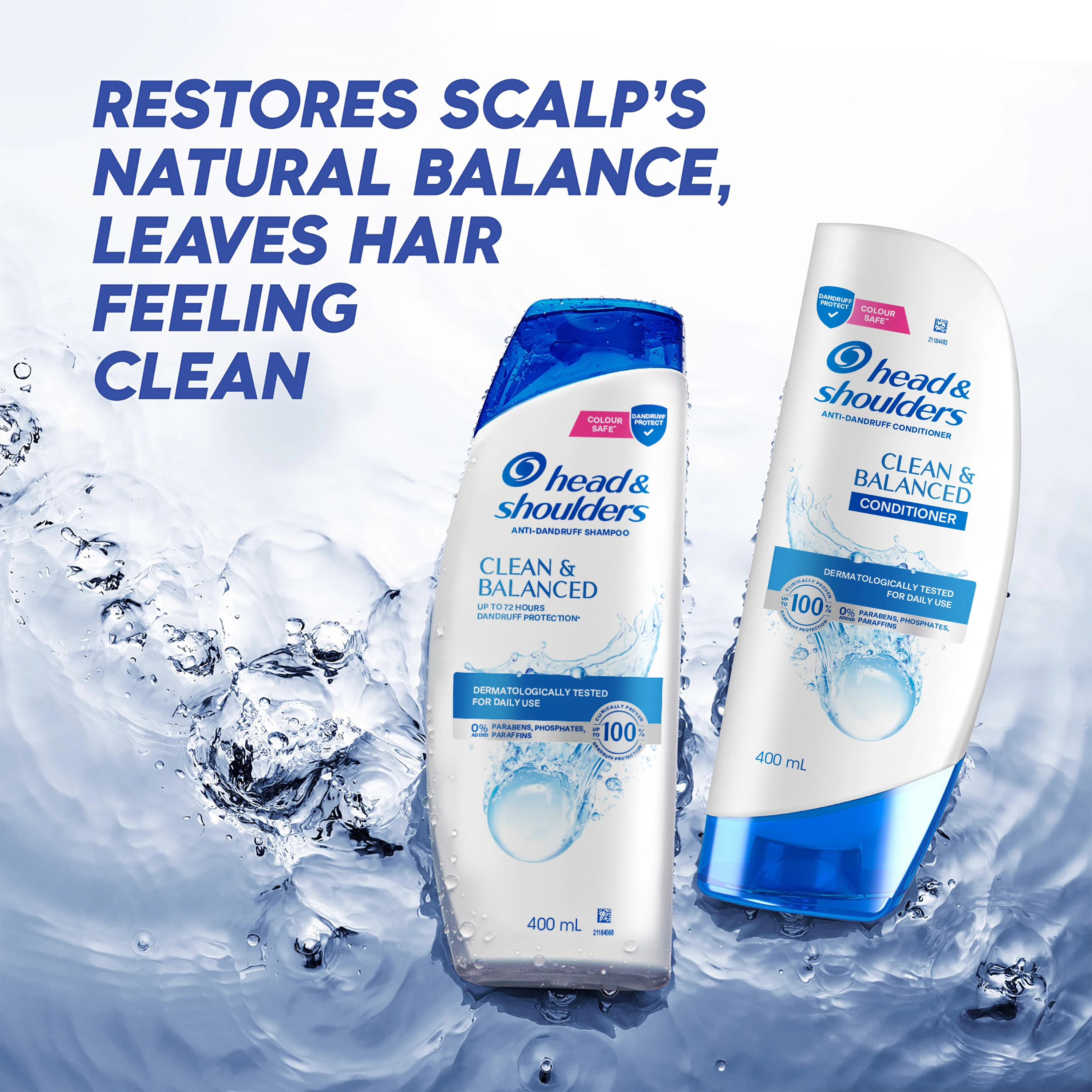 Hand holding a bottle of Head & Shoulders Clean & Balanced anti-dandruff shampoo in a white tiled shower