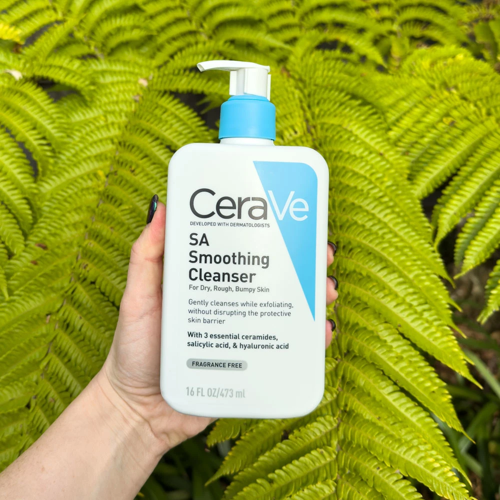CeraVe SA Smoothing Cleanser in-front of leaves