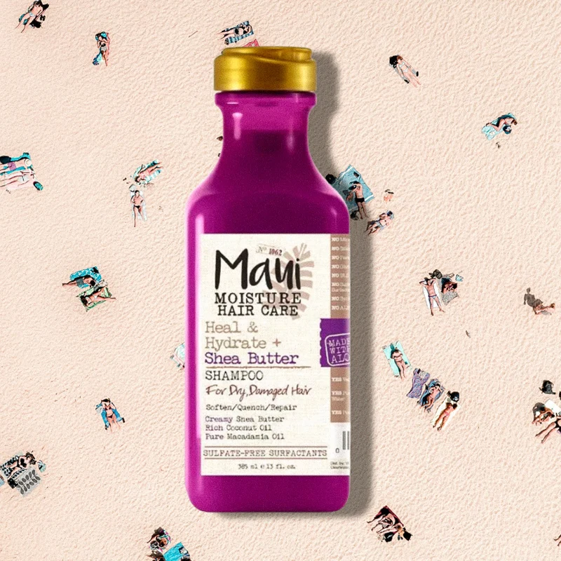 Hair care products on white carpet: pink Maui Moisture shea butter conditioner bottle and two Redken styling spray bottles