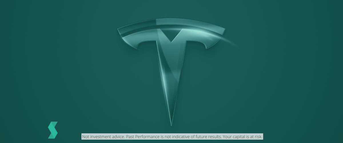 Tesla logo in back background