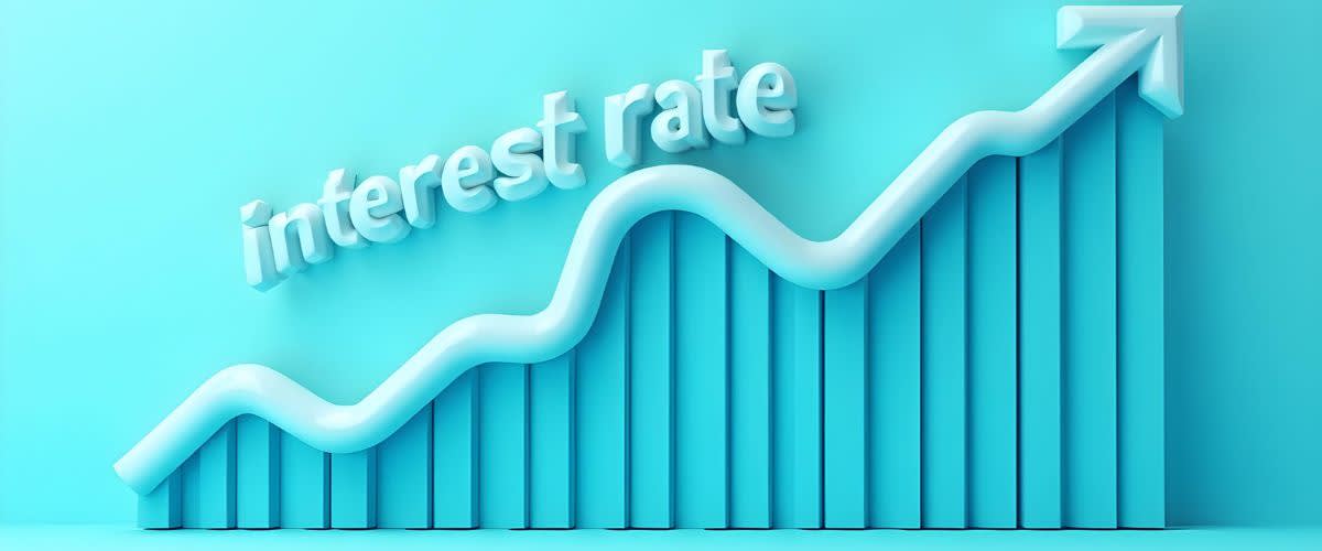 Un gráfico que muestra una tendencia reciente al aumento de las tasas de interés sobre un fondo azul