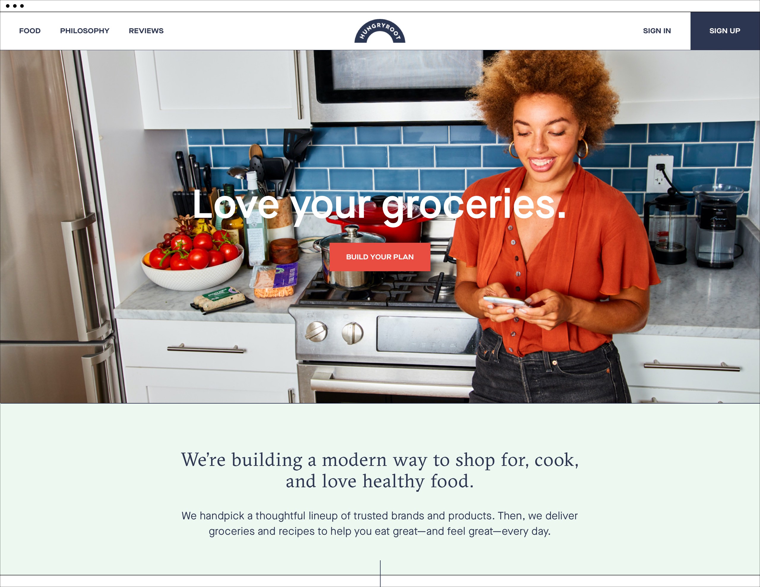 Woman in kitchen planning dinner using her mobile phone. Headline reads Love Your Groceries