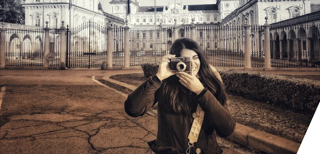 A photo of Francesca Condorelli taking a picture with a camera