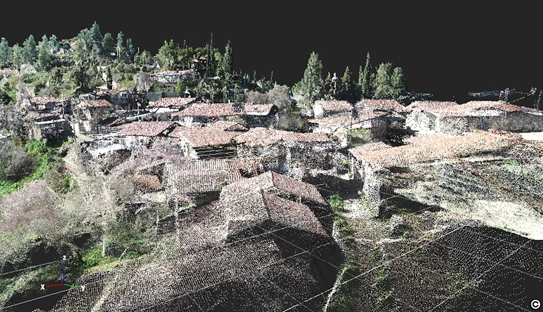 A 3D point cloud mesh created from drone photography of the village.