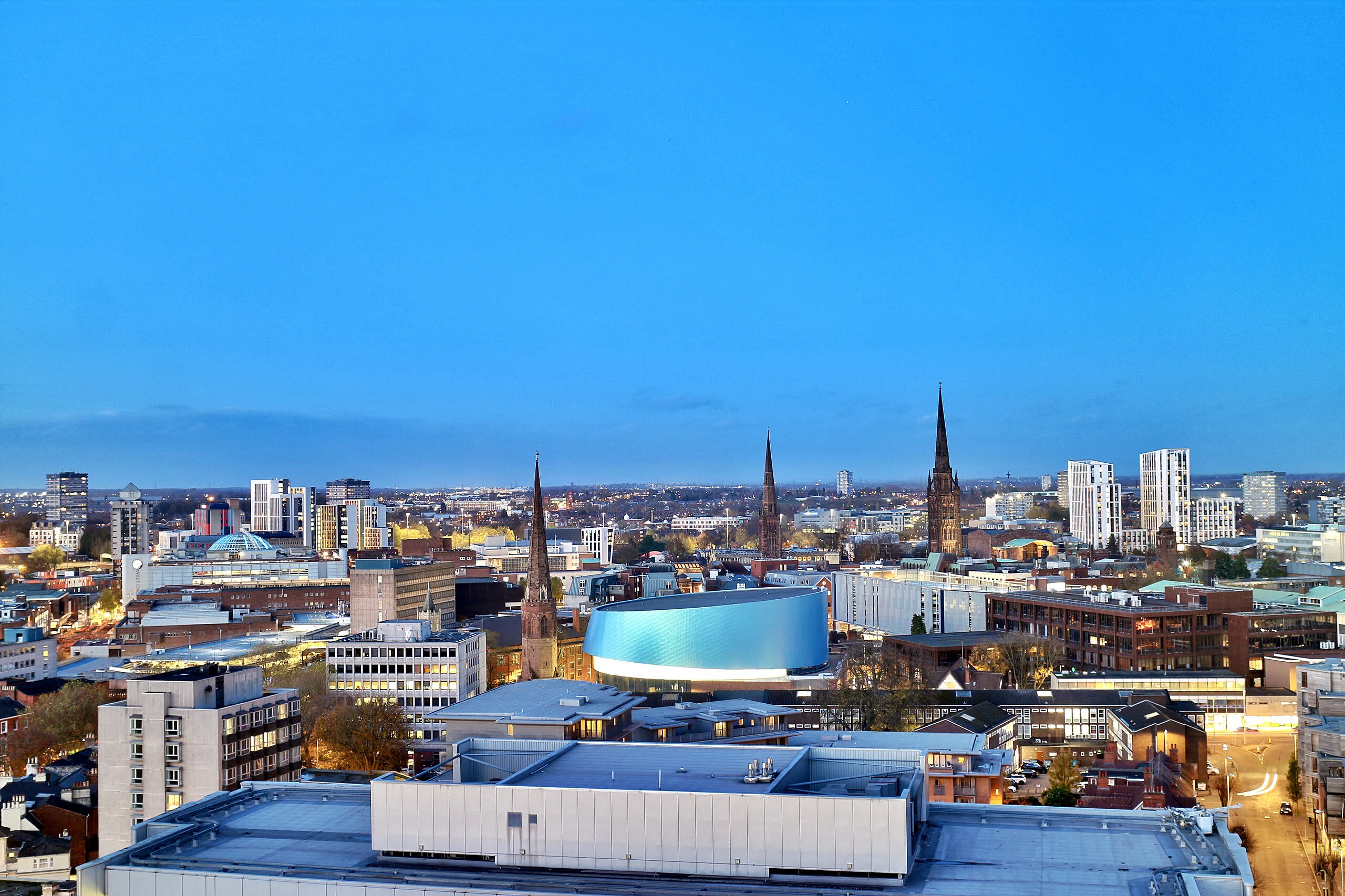 colour photograph of Coventry city centre in the evening.