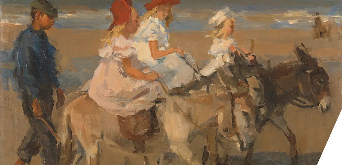 Children riding donkeys on the beach