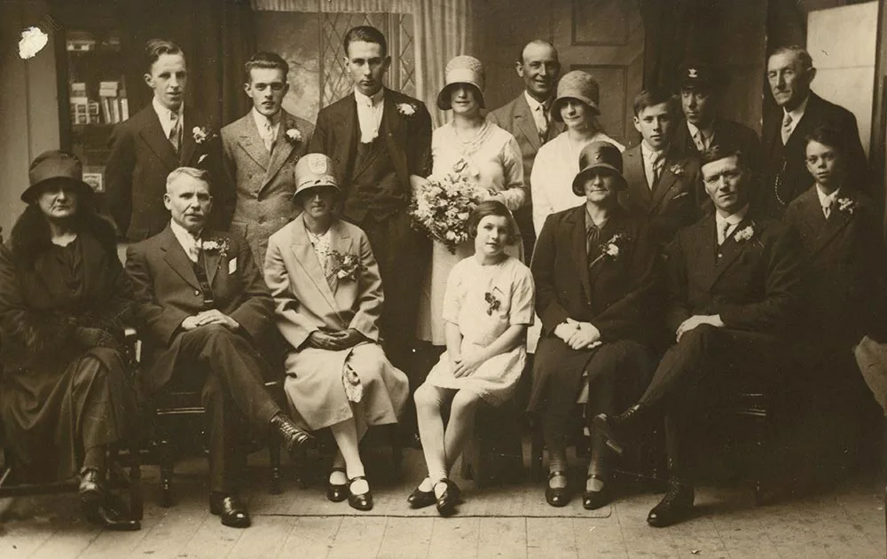 black and white photograph, portrait of a family at a wedding