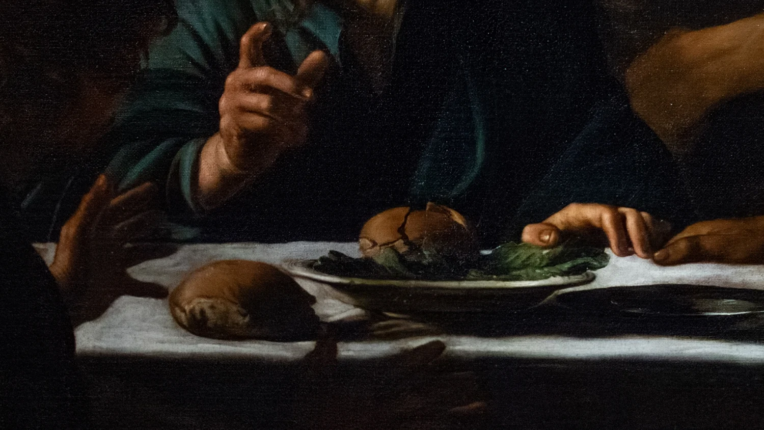 Detail of a painting: a bread on a plate atop a white tablecloth in a dimly lit setting.