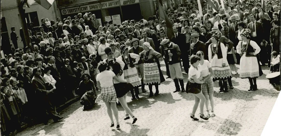 People dancing in a crowded square