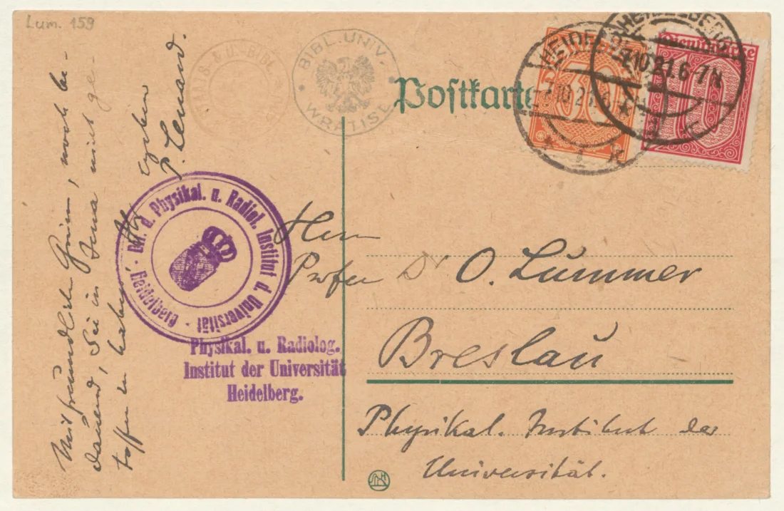 back of colour postcard with handwritten text and two stamps