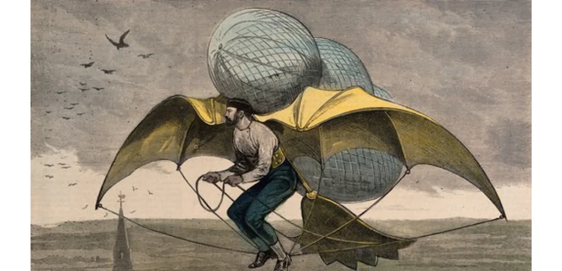 A man flying in the air with wings and balloons attached to him.