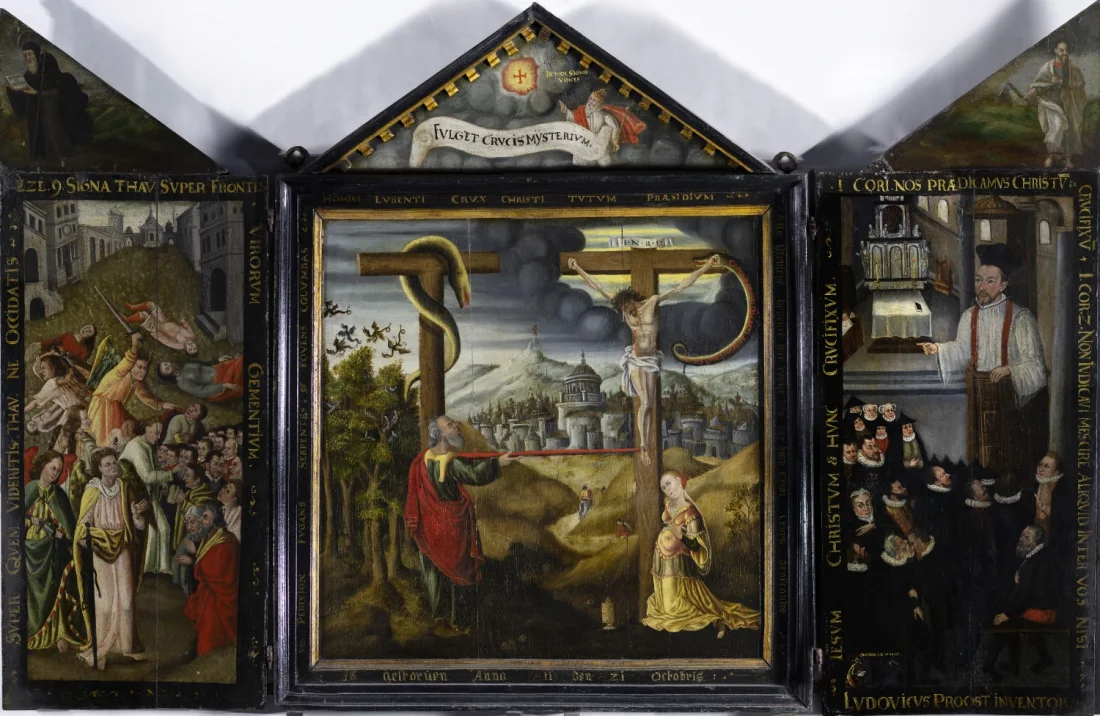 A wooden polychrome triptych consisting of three panels hinged together with painted scenes