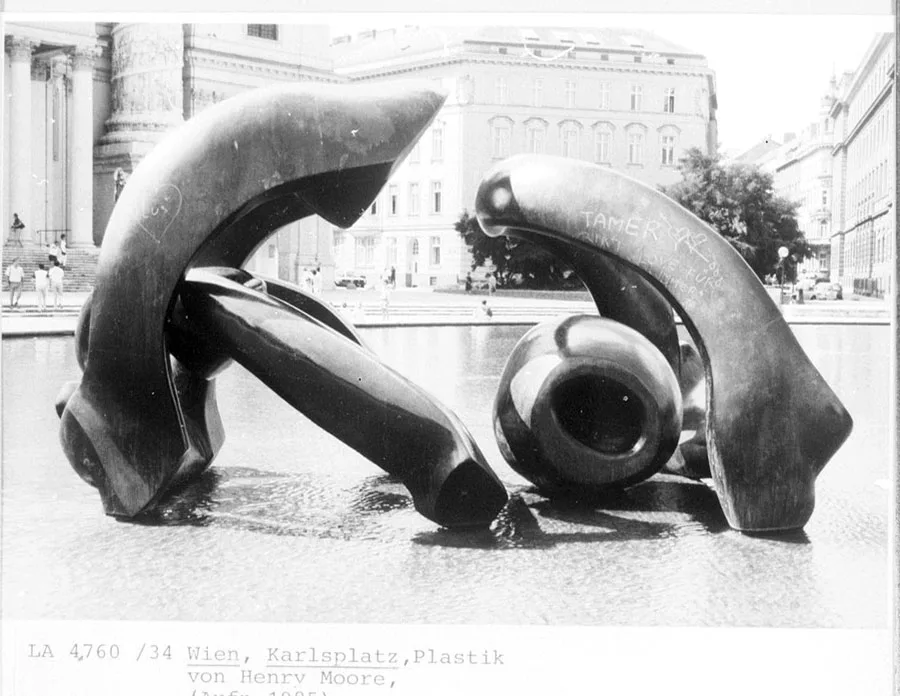 black and white photograph of a sculpture in a fountain