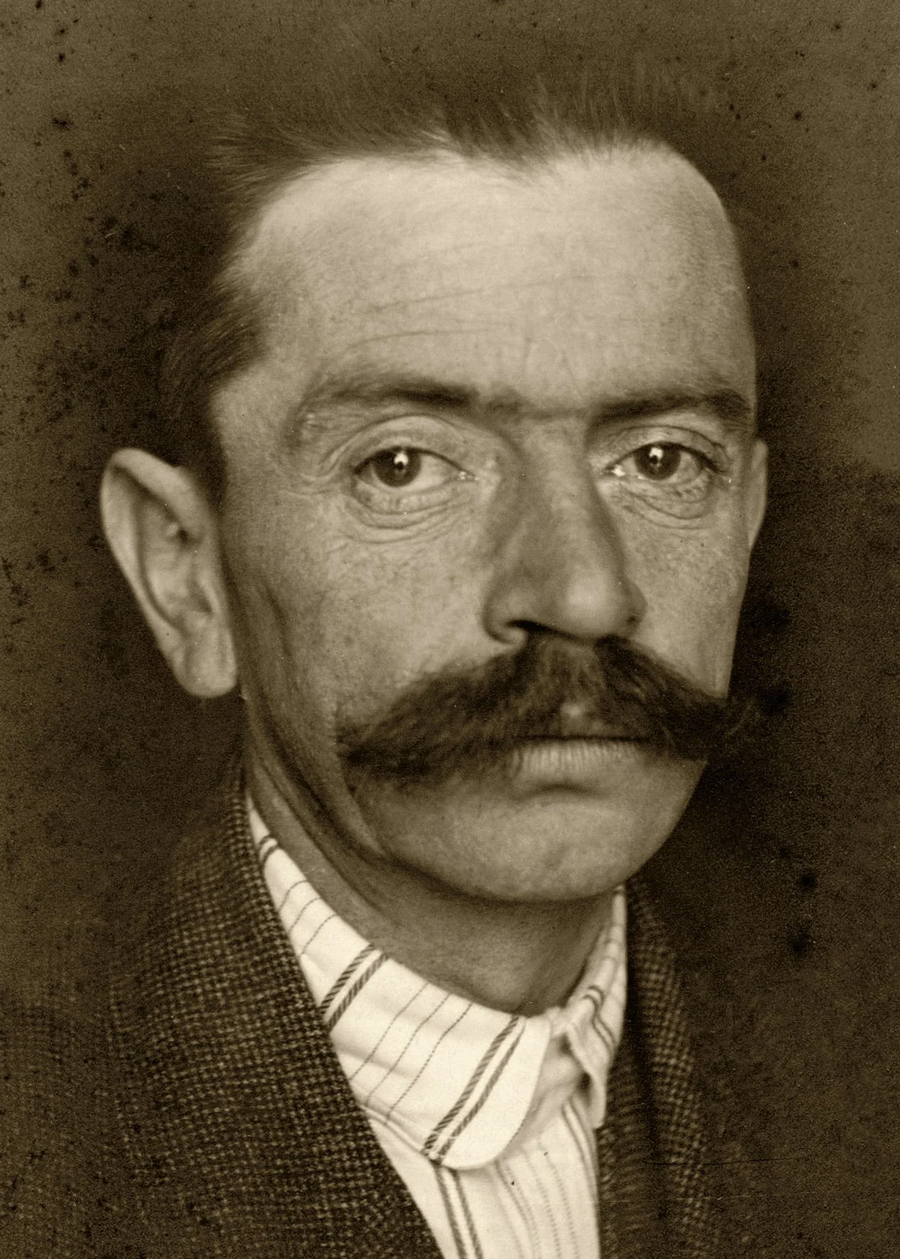 sepia-toned portrait photograph of Ivan Cankar.