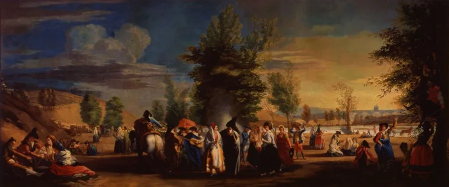un cuadro de la Pradera de San Isidro, grupos de personas celebrando, bailando y tocando instrumentos musicales en un paisaje de colinas con árboles y un lago al fondo.