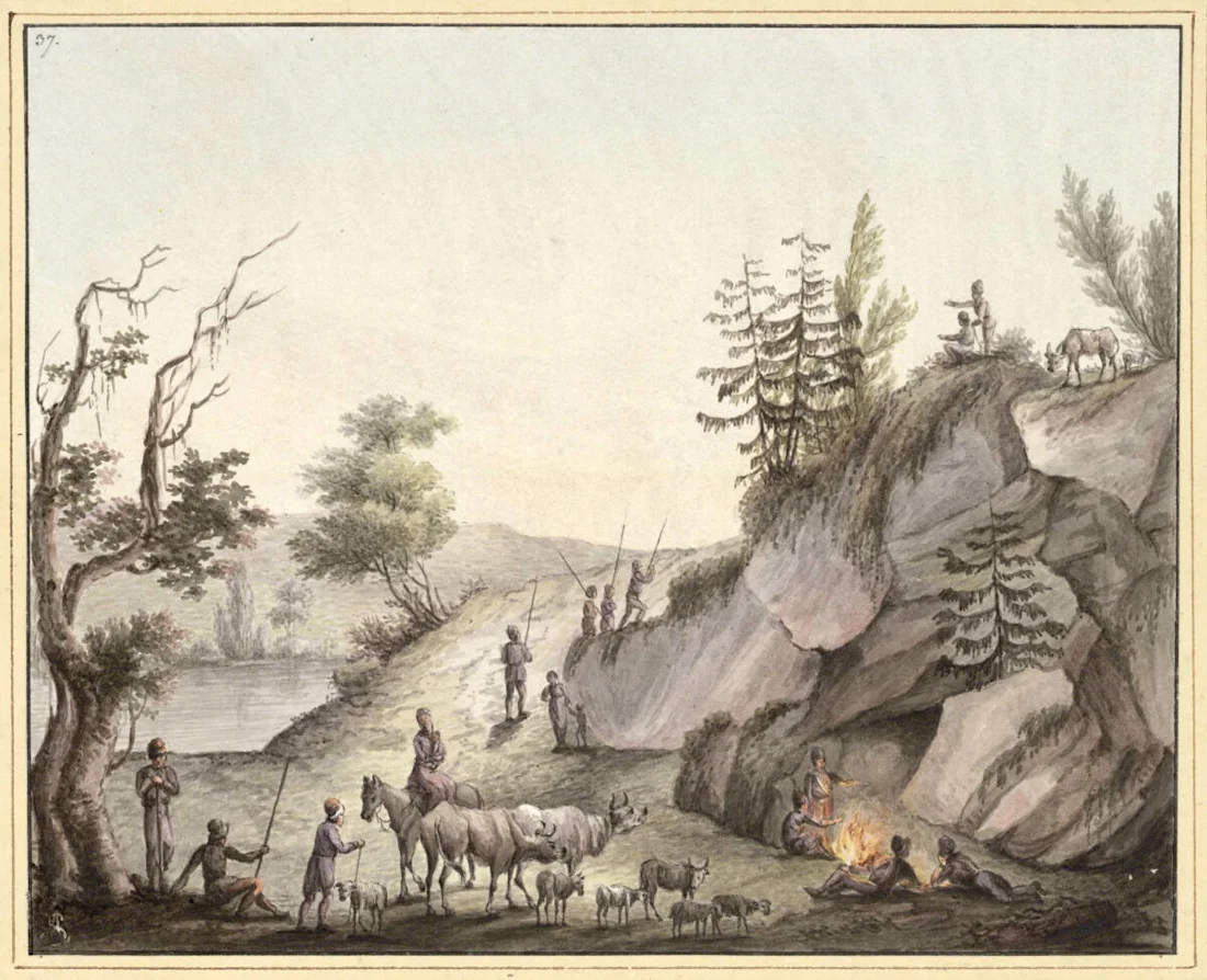 People with livestock and dogs near a rocky hill, some around a campfire, trees and a river in the background.