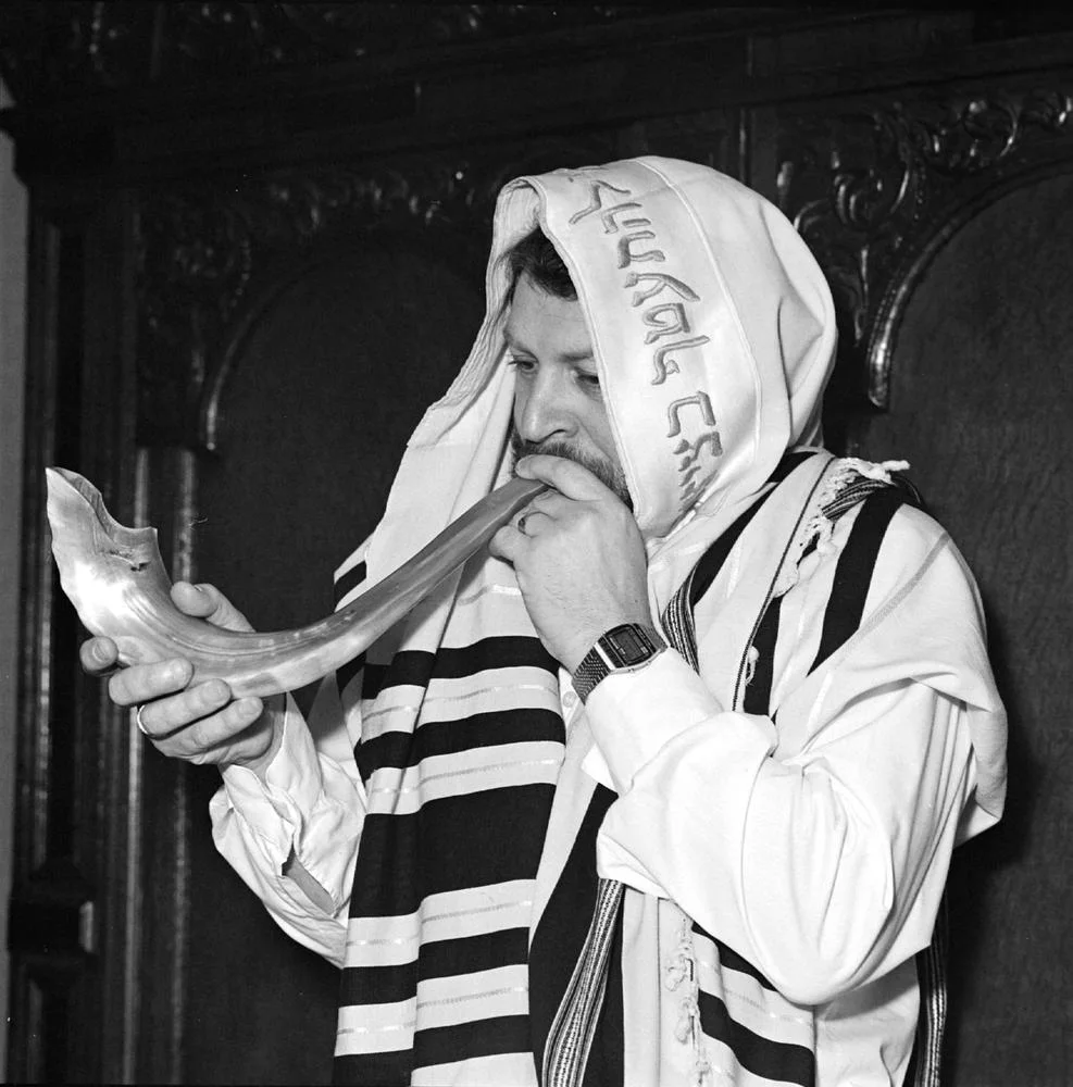 A man blowing a shofar