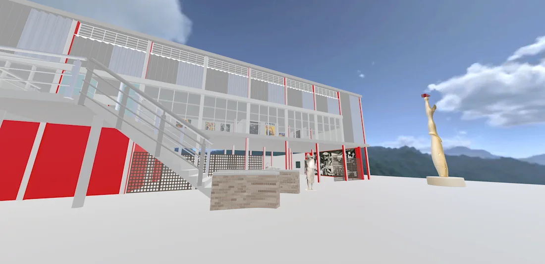 Modern building with red and white panels, outdoor stairs, brick seating, and tall sculpture under blue sky.