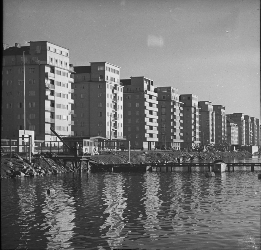 High rise buildings in a row next to a river in Stockholm