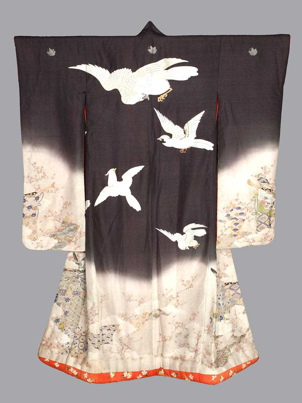 colour photograph of kimono which is mostly black and white with a motif of hawks