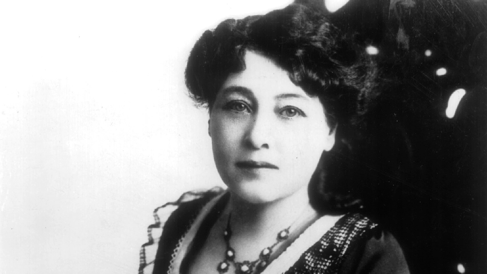black and white portrait photograph of Alice Guy-Blaché. 