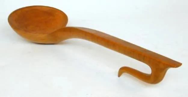colour photograph of a wooden ladle