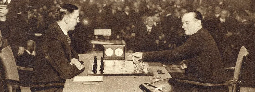 sepia photograph of two men playing chess