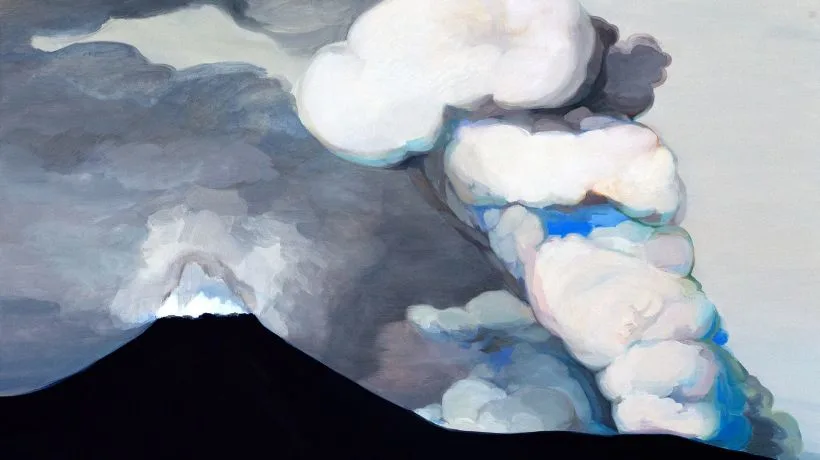 A dark volcano erupts, sending thick, billowing white and gray smoke into a cloudy sky.