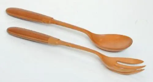 colour photograph of a pair of wooden salad servers