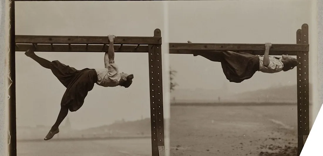 A gymnast hanging on bars